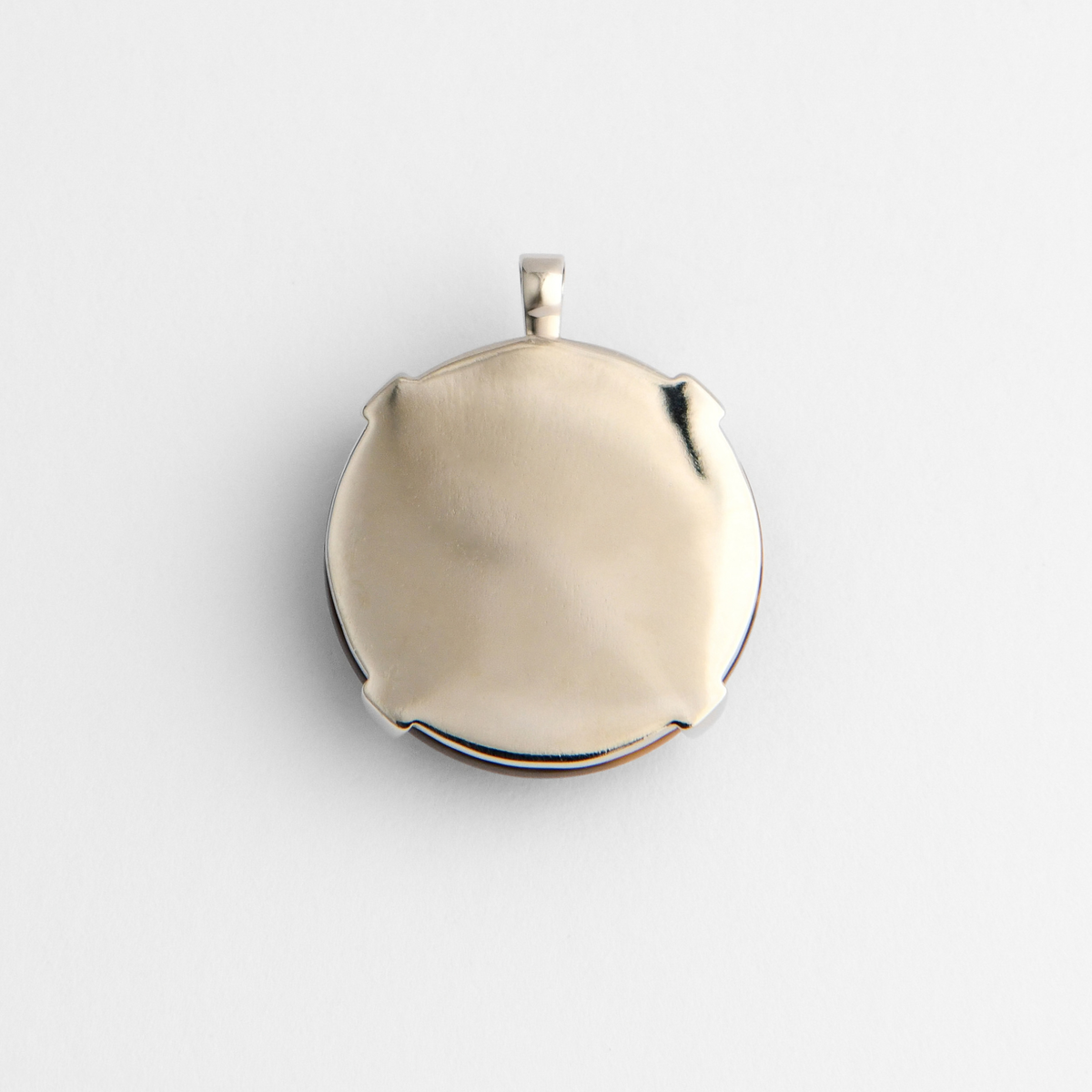 Back of Spar in cool, silvery white bronze, showing its smooth, plain reverse for personalised engraving.