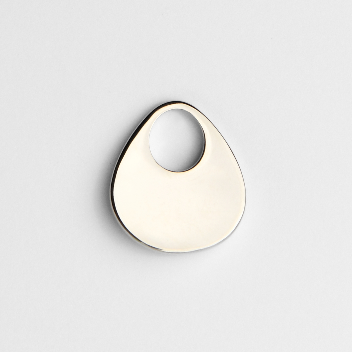 Back of Argo in cool, silvery white bronze, showing its smooth, plain reverse for personalised engraving.