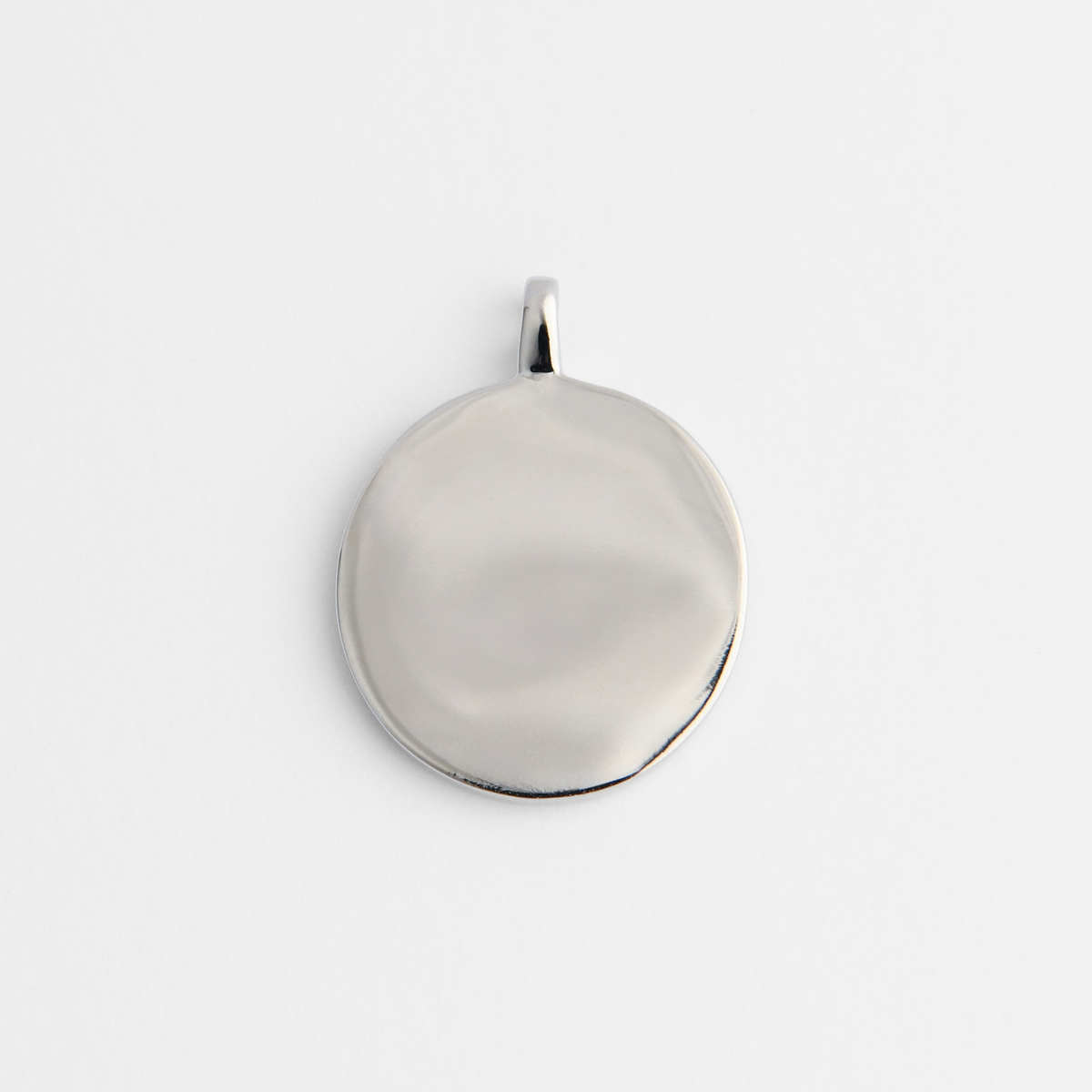 Back of Caligo in cool, silvery white bronze, showing its smooth, plain reverse for personalised engraving.