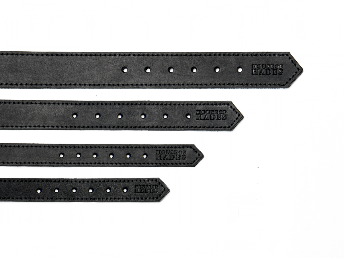 The tail-end of four black cowhide leather dog collars in sizes XS, S, M and L, laid flat to compare their widths. Each size has six adjustment holes, black edge stitching and a House of Hades stamp near the pointed end.
