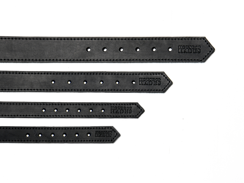 The tail-end of four black cowhide leather dog collars in sizes XS, S, M and L, laid flat to compare their widths. Each size has six adjustment holes, black edge stitching and a House of Hades stamp near the pointed end.