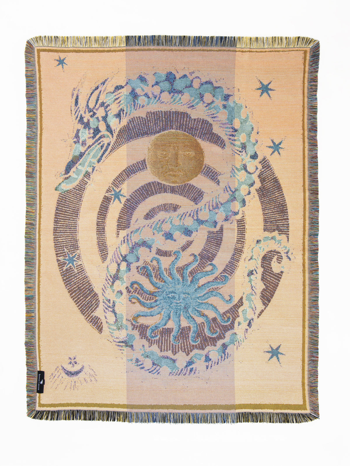 Reverse of the Liminal Creatures woven throw in warm cream and soft peach, with a pale turquoise, blue and blush dragon coiling around a dark bird’s-eye spiral. A muted golden moon and vivid blue sun sit within the spiral, surrounded by blue stars and celestial motifs.