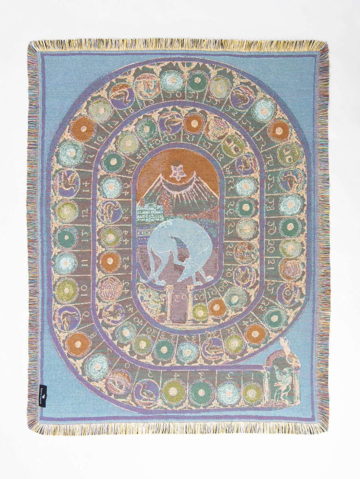 Reverse of the Wayward & Wandering woven throw in powder blue, with the winding numbered game board transformed into muted green, lilac, ochre and pale turquoise. At its centre, a pale blue hound wanders through a warm rust-coloured landscape beneath a crescent moon, while the tiny Cupid tends the garden behind him.
