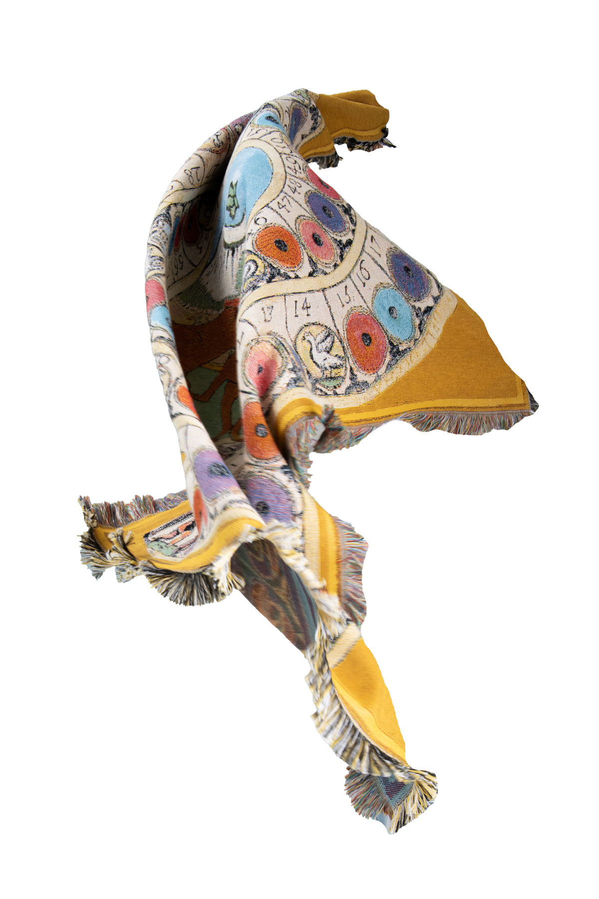 Wayward & Wandering mustard yellow woven cotton throw twisting through the air, revealing its colourful illustrated design and fringed edges.